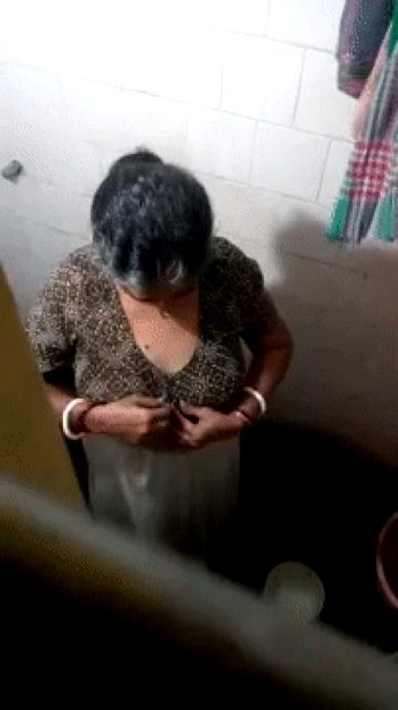 Big boobs Indian aunty undressing at bathroom
