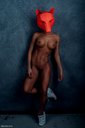 Hot lady in sneakers and fox mask